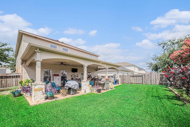 21530 Amesbury Meadow Ln, Spring, TX 77379 - rear view of property with ceiling fan, a fenced backyard, and a patio area