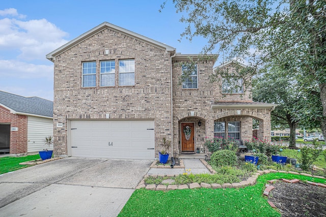 21530 Amesbury Meadow Ln, Spring, TX 77379 - traditional home with brick siding, a garage, and driveway