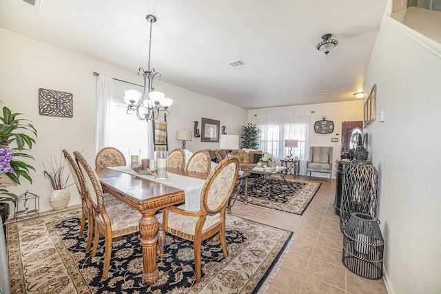 21530 Amesbury Meadow Ln, Spring, TX 77379 - dining room featuring a chandelier and light tile patterned flooring