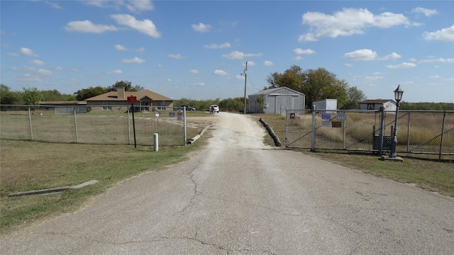 17930 N Interstate 35, West, TX 76691 - view of asphalt driveway featuring a gate and a gated entry