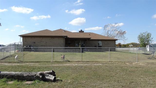 17930 N Interstate 35, West, TX 76691 - rear view of house featuring brick siding, a chimney, and a shingled roof