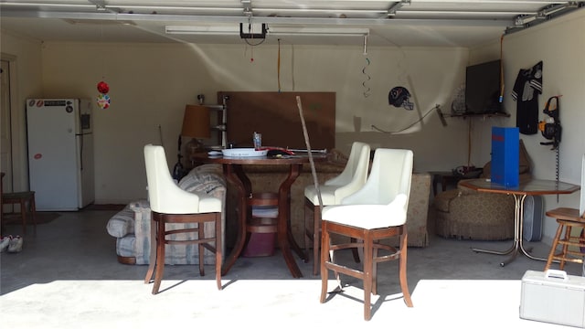 17930 N Interstate 35, West, TX 76691 - garage featuring freestanding refrigerator and a garage door opener