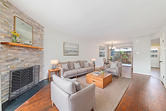2601 S Braeswood Blvd Unit 302, Houston, TX 77025 - living area with dark wood-style floors, a chandelier, and a fireplace