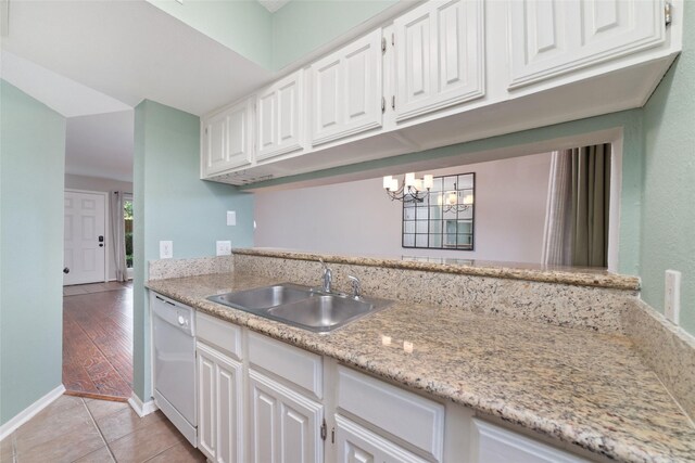2601 S Braeswood Blvd Unit 302, Houston, TX 77025 - kitchen featuring dishwasher, a chandelier, and white cabinetry