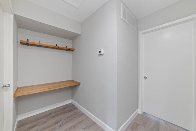 2601 S Braeswood Blvd Unit 302, Houston, TX 77025 - mudroom with wood finished floors