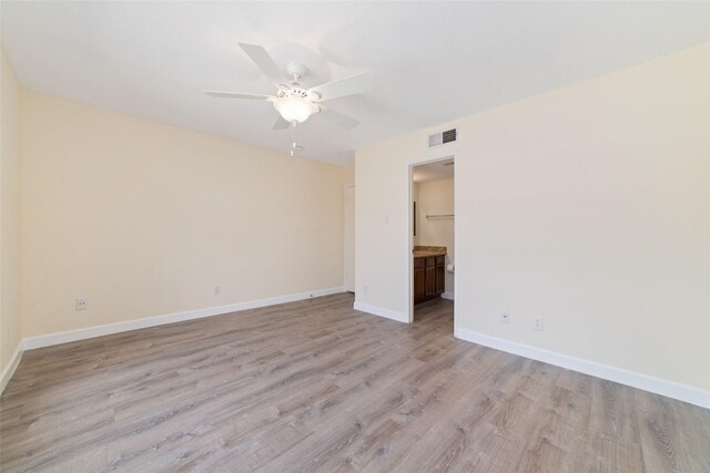 2601 S Braeswood Blvd Unit 302, Houston, TX 77025 - spare room featuring light wood-style flooring and ceiling fan