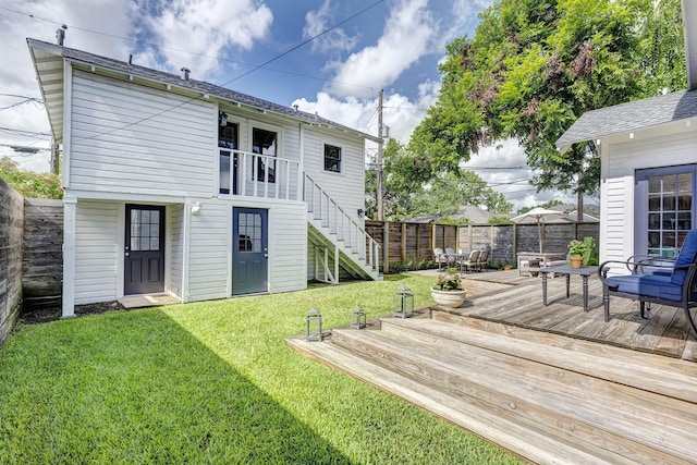 936 W Temple St, Houston, TX 77009 - back of house with stairway, a wooden deck, a fenced backyard, and roof with shingles
