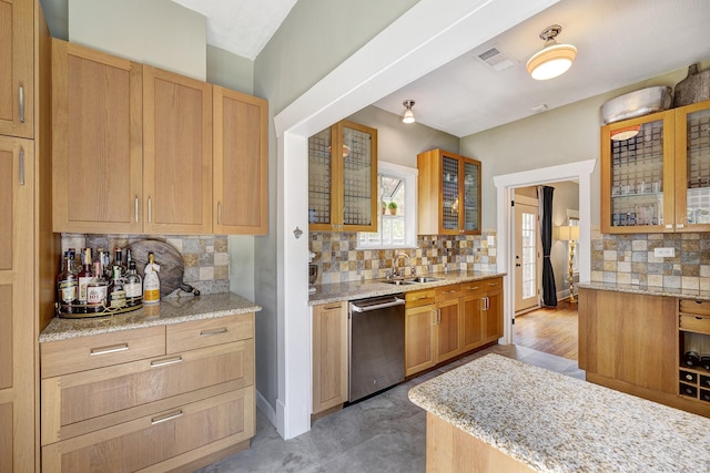 936 W Temple St, Houston, TX 77009 - kitchen with dishwasher, decorative backsplash, light stone counters, and glass insert cabinets