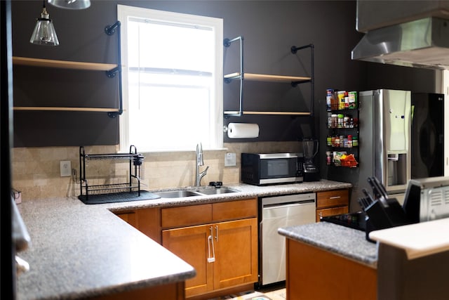 8309 Williamsdell St, Houston, TX 77088 - kitchen with appliances with stainless steel finishes, extractor fan, brown cabinets, tasteful backsplash, and open shelves