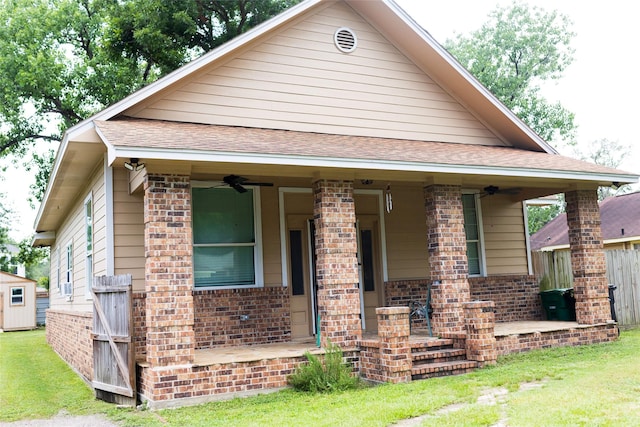 8309 Williamsdell St, Houston, TX 77088 - view of front facade with brick siding, covered porch, ceiling fan, and roof with shingles