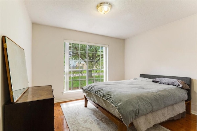 2210 Elm Forest Dr, Pearland, TX 77584 - bedroom featuring wood finished floors