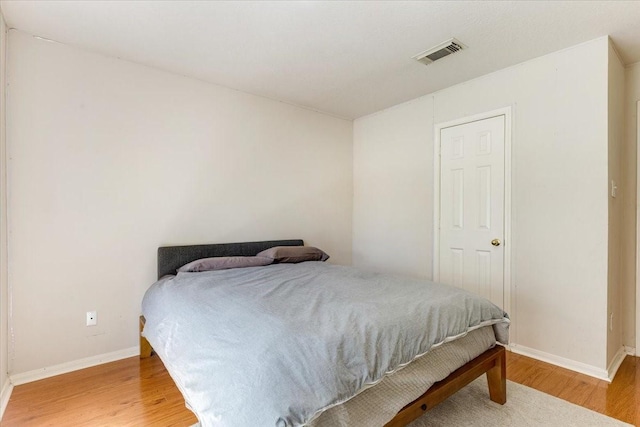 2210 Elm Forest Dr, Pearland, TX 77584 - bedroom featuring light wood finished floors and baseboards