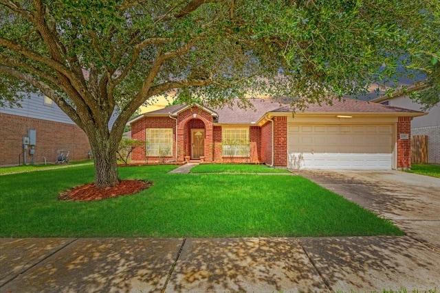 2210 Elm Forest Dr, Pearland, TX 77584 - view of front of house with driveway, a garage, a front lawn, and brick siding
