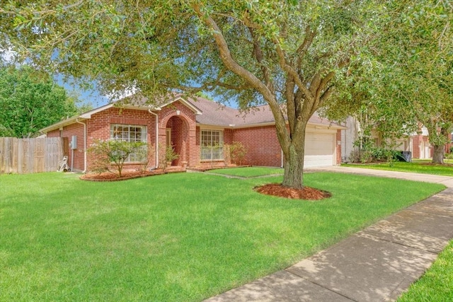 2210 Elm Forest Dr, Pearland, TX 77584 - view of front of home with brick siding, driveway, and a garage