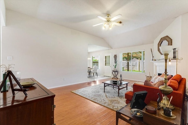 2210 Elm Forest Dr, Pearland, TX 77584 - living area featuring a ceiling fan, wood finished floors, and lofted ceiling