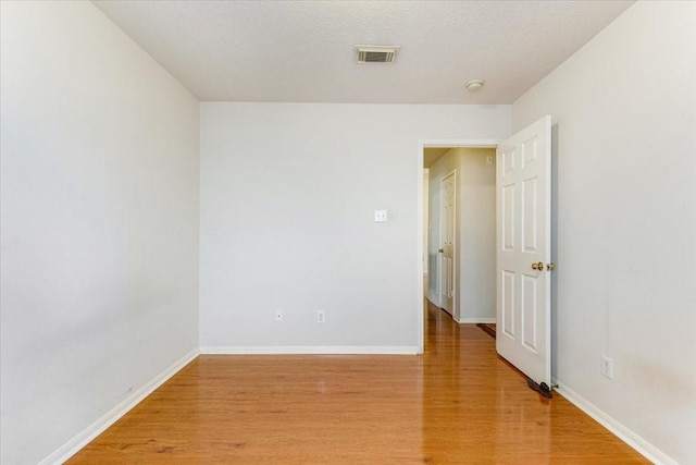 2210 Elm Forest Dr, Pearland, TX 77584 - unfurnished room with light wood-style floors and baseboards