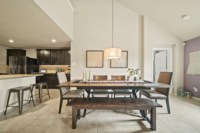 29023 Jacobs River Dr, Katy, TX 77494 - dining space with high vaulted ceiling, light tile patterned floors, and recessed lighting