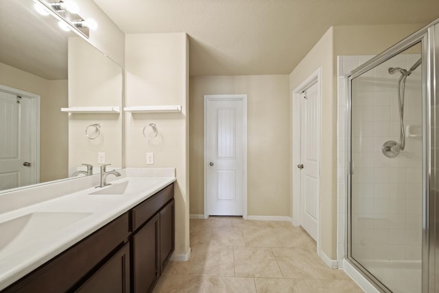 29023 Jacobs River Dr, Katy, TX 77494 - bathroom with a stall shower, double vanity, and tile patterned floors