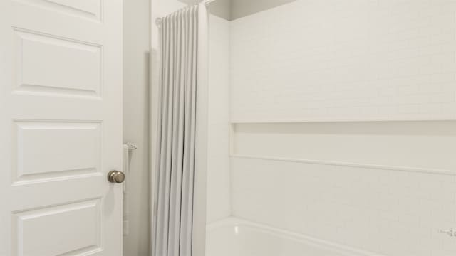 13328 Burbot Dr, Conroe, TX 77384 - bathroom with shower / bath combination with curtain