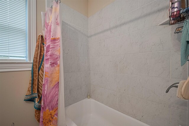 604 Abell St, Wharton, TX 77488 - bathroom with shower / bathtub combination with curtain