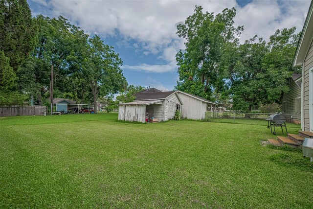 604 Abell St, Wharton, TX 77488 - view of yard with a storage unit