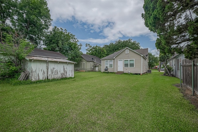 604 Abell St, Wharton, TX 77488 - view of yard with entry steps and a storage shed