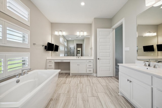 19526 Rock Quillwort Rd, Cypress, TX 77433 - bathroom featuring a tub to relax in and two vanities