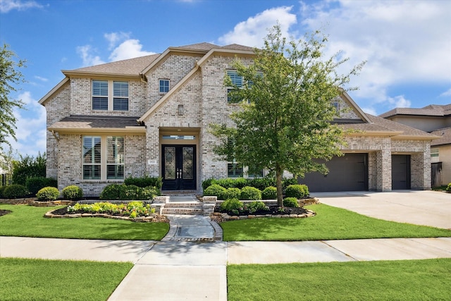 19526 Rock Quillwort Rd, Cypress, TX 77433 - french country inspired facade with french doors, brick siding, concrete driveway, and a front yard