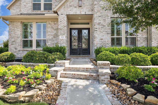 19526 Rock Quillwort Rd, Cypress, TX 77433 - view of exterior entry featuring brick siding and french doors