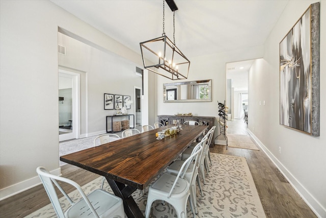 19526 Rock Quillwort Rd, Cypress, TX 77433 - dining room featuring a chandelier and wood finished floors