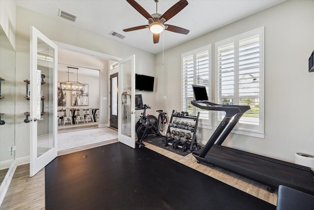 19526 Rock Quillwort Rd, Cypress, TX 77433 - workout area with french doors, ceiling fan, wood finished floors, and a chandelier