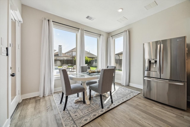 19526 Rock Quillwort Rd, Cypress, TX 77433 - dining area with light wood-style flooring and baseboards