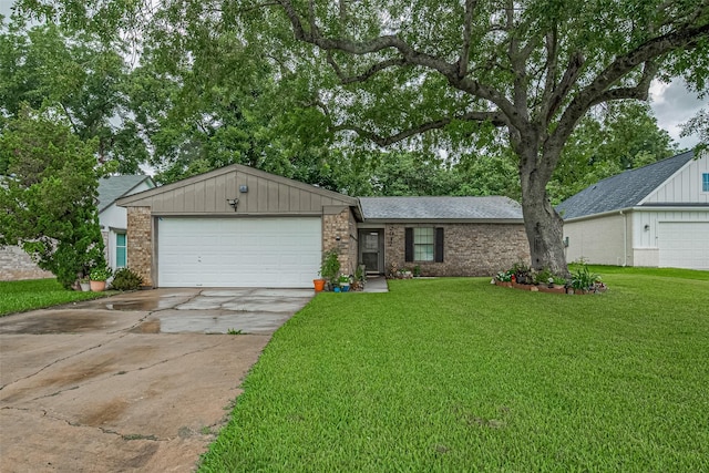 2017 Willow Bend Rd, Wharton, TX 77488 - ranch-style home featuring driveway, a garage, a front yard, and brick siding