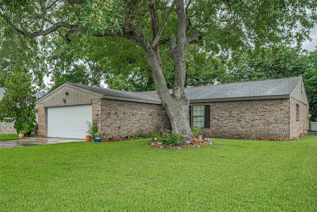 2017 Willow Bend Rd, Wharton, TX 77488 - ranch-style house featuring brick siding, a garage, driveway, a front lawn, and roof with shingles