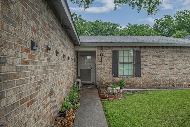 2017 Willow Bend Rd, Wharton, TX 77488 - entrance to property with a lawn, brick siding, and a shingled roof