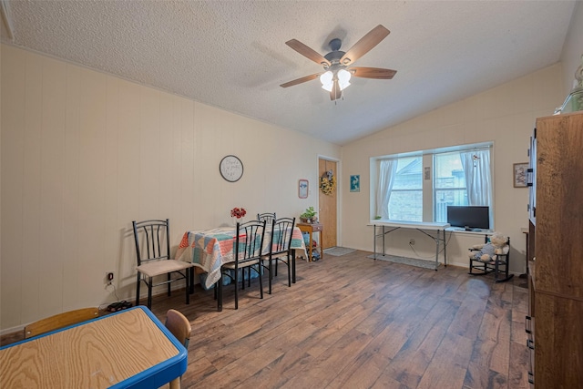 2017 Willow Bend Rd, Wharton, TX 77488 - dining area with wood-type flooring, ceiling fan, vaulted ceiling, and a textured ceiling