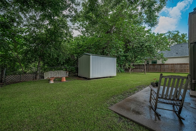2017 Willow Bend Rd, Wharton, TX 77488 - fenced backyard featuring a storage unit and a patio