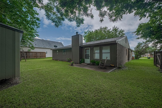 2017 Willow Bend Rd, Wharton, TX 77488 - back of property with a chimney and a patio area