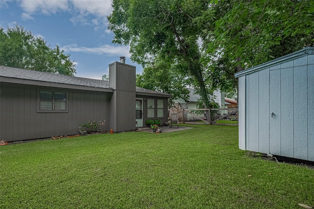 2017 Willow Bend Rd, Wharton, TX 77488 - view of yard featuring a patio area and an outbuilding