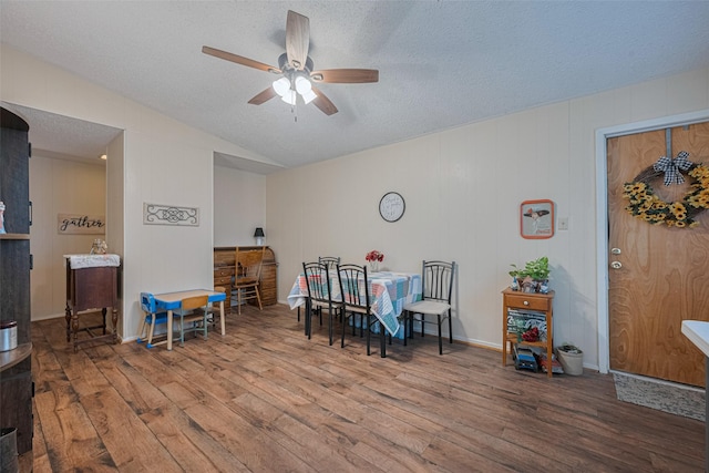2017 Willow Bend Rd, Wharton, TX 77488 - dining area with wood finished floors, ceiling fan, a textured ceiling, and vaulted ceiling