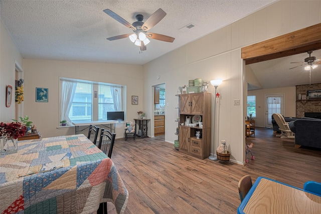 2017 Willow Bend Rd, Wharton, TX 77488 - dining room with a ceiling fan, wood finished floors, lofted ceiling, and a textured ceiling
