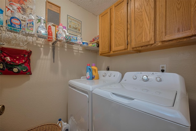 2017 Willow Bend Rd, Wharton, TX 77488 - washroom featuring washing machine and clothes dryer, cabinet space, and a textured ceiling