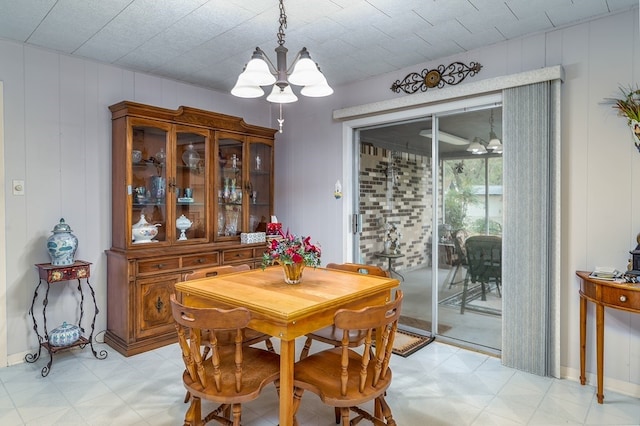 860 Helter St, La Grange, TX 78945 - dining area featuring light floors, a chandelier, and a decorative wall