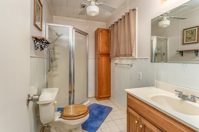 860 Helter St, La Grange, TX 78945 - bathroom with a ceiling fan, a stall shower, vanity, and tile patterned floors