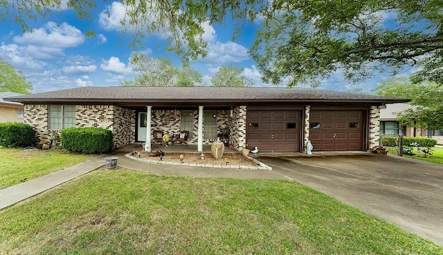 860 Helter St, La Grange, TX 78945 - single story home with an attached garage, a front yard, concrete driveway, covered porch, and brick siding