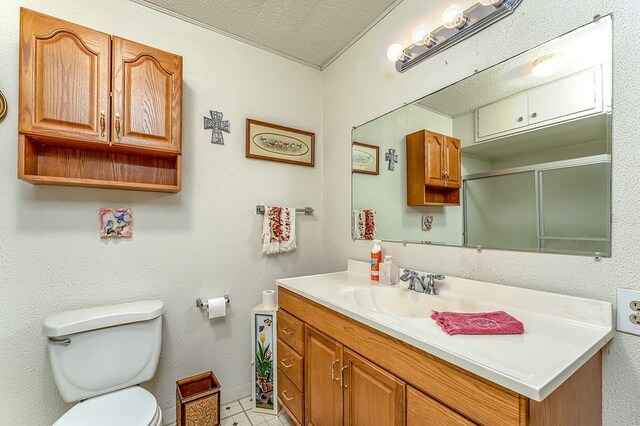 860 Helter St, La Grange, TX 78945 - full bathroom with vanity, a textured ceiling, and an enclosed shower