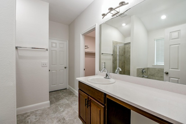 167 Courageous Side Way, Magnolia, TX 77354 - bathroom with a shower stall, vanity, a walk in closet, and recessed lighting