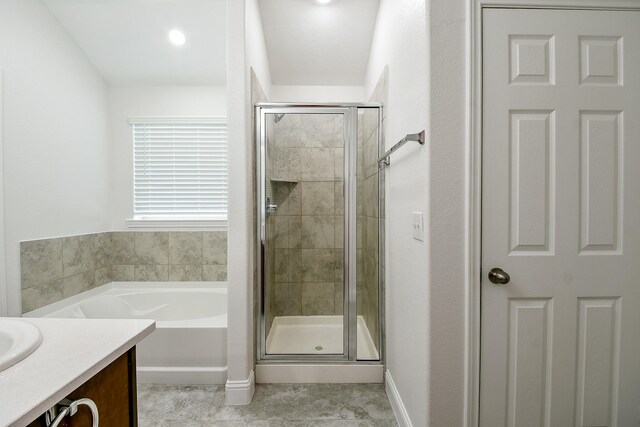 167 Courageous Side Way, Magnolia, TX 77354 - bathroom featuring a bath, a stall shower, vanity, and tile patterned floors