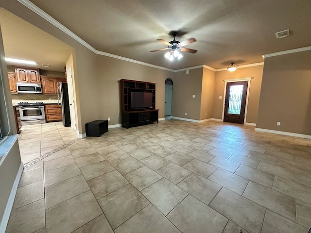 1040 Cardinal Dr, Richwood, TX 77566 - unfurnished living room featuring ornamental molding, a ceiling fan, and arched walkways