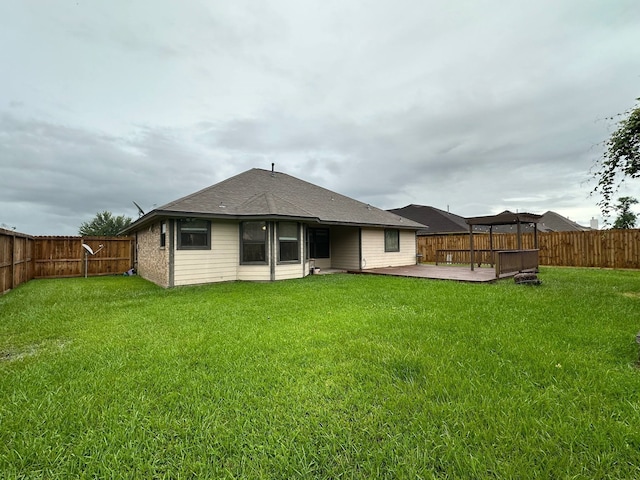 1040 Cardinal Dr, Richwood, TX 77566 - rear view of property with a fenced backyard, a deck, and a shingled roof